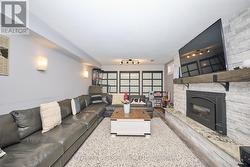 Lower Media Room with Gas Fireplace - 