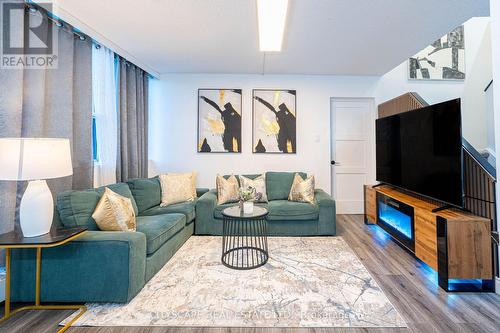 115 - 2121 Roche Court, Mississauga, ON - Indoor Photo Showing Living Room With Fireplace