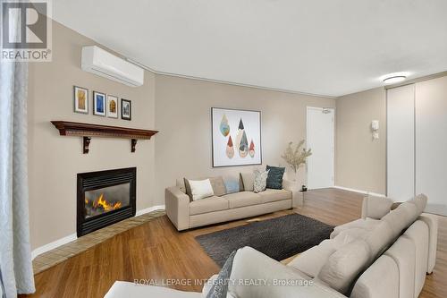 A - 214 Equestrian Drive N, Ottawa, ON - Indoor Photo Showing Living Room With Fireplace