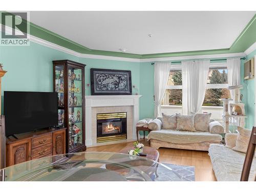 3300 Centennial Drive Unit# 204, Vernon, BC - Indoor Photo Showing Living Room With Fireplace