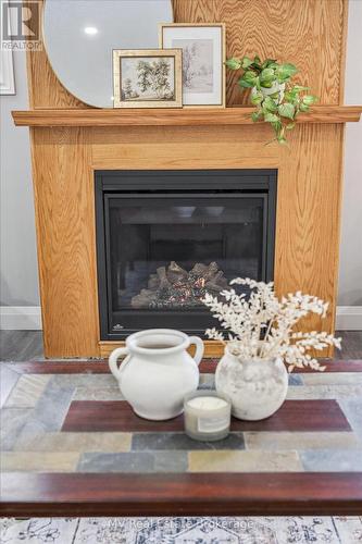 115 Harper Crescent, Centre Wellington (Fergus), ON - Indoor Photo Showing Living Room With Fireplace