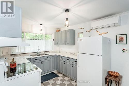 9 Harras Avenue, Tiny, ON - Indoor Photo Showing Kitchen With Double Sink