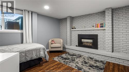 10628 Halstead Crescent, Windsor, ON - Indoor Photo Showing Bedroom With Fireplace
