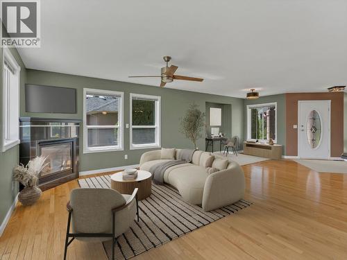 VIRTUALLY STAGED FURNITURE IN LIVING ROOM - 1893 Sandstone Drive, Penticton, BC - Indoor Photo Showing Living Room With Fireplace
