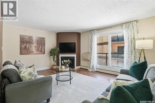 15 274 Pinehouse Drive, Saskatoon, SK - Indoor Photo Showing Living Room With Fireplace