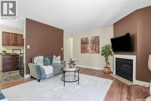 15 274 Pinehouse Drive, Saskatoon, SK - Indoor Photo Showing Living Room With Fireplace