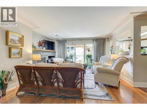 1964 Enterprise Way Unit# 309, Kelowna, BC - Indoor Photo Showing Living Room With Fireplace