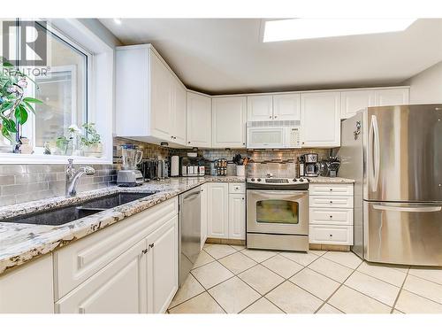 1964 Enterprise Way Unit# 309, Kelowna, BC - Indoor Photo Showing Kitchen With Double Sink