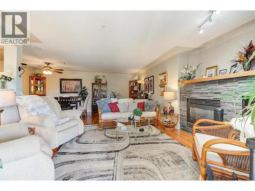1964 Enterprise Way Unit# 309, Kelowna, BC - Indoor Photo Showing Living Room With Fireplace
