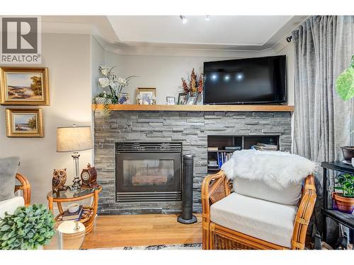 1964 Enterprise Way Unit# 309, Kelowna, BC - Indoor Photo Showing Living Room With Fireplace
