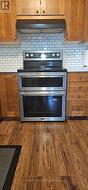 Double oven stove to be installed before closing. - 