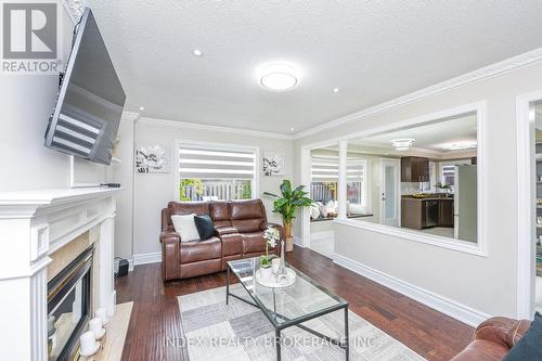 10 Leopard Gate, Brampton, ON - Indoor Photo Showing Living Room With Fireplace