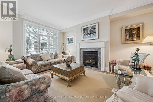 Living Area with Hardwood Flooring & Gas Fireplace - 26 - 2369 Ontario Street, Oakville, ON - Indoor Photo Showing Living Room With Fireplace