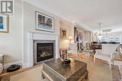 Open Living & Dining Areas Ideal for Entertaining - 26 - 2369 Ontario Street, Oakville, ON - Indoor Photo Showing Living Room With Fireplace