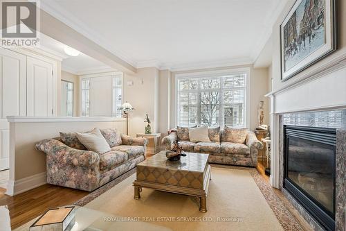 Living Area with Hardwood Flooring & Gas Fireplace - 26 - 2369 Ontario Street, Oakville, ON - Indoor Photo Showing Living Room With Fireplace
