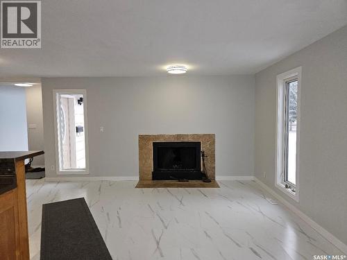 1111 Centennial Way, Humboldt, SK - Indoor Photo Showing Living Room With Fireplace