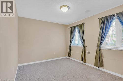 Spare room with carpet floors and baseboards - 33 Wellington S, Cambridge, ON - Indoor