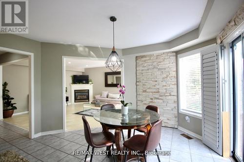 7374 Black Walnut Trail, Mississauga, ON - Indoor Photo Showing Dining Room With Fireplace