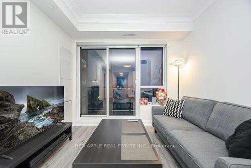 1207 - 18 Water Walk Drive, Markham, ON - Indoor Photo Showing Living Room With Fireplace