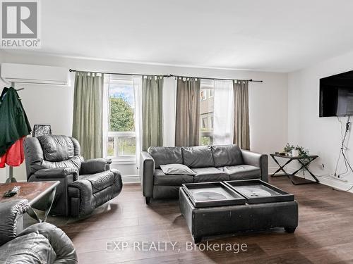 64 - 2050 Upper Middle Road, Burlington, ON - Indoor Photo Showing Living Room