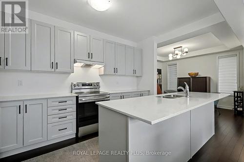Island with breakfast bar - 24 Ferguson Street, Erin, ON - Indoor Photo Showing Kitchen With Double Sink