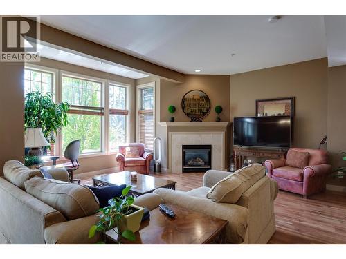 1795 Country Club Drive Unit# 105, Kelowna, BC - Indoor Photo Showing Living Room With Fireplace