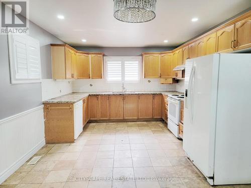 Kitchen and Eat-In Area - 34 Robinson Avenue, Kawartha Lakes, ON - Indoor Photo Showing Kitchen With Double Sink
