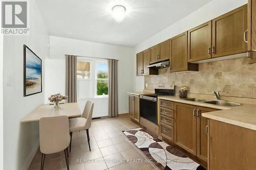 Virtually Staged - 22 Worsley Road, Hamilton, ON - Indoor Photo Showing Kitchen With Double Sink