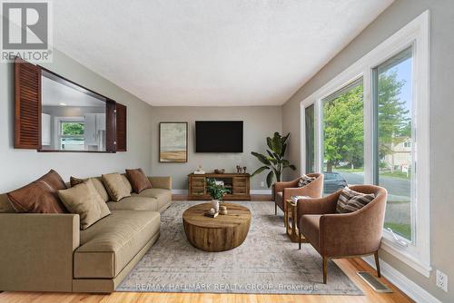 Unit 1 living virtually staged - 426 Blake Boulevard, Ottawa, ON - Indoor Photo Showing Living Room