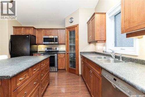 102 Keedwell Street, Saskatoon, SK - Indoor Photo Showing Kitchen With Double Sink
