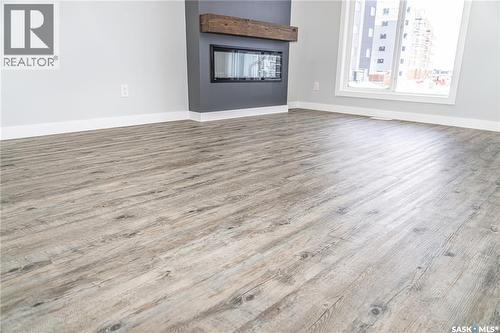 198 Sharma Lane, Saskatoon, SK - Indoor Photo Showing Other Room With Fireplace