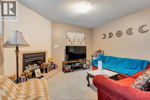 569 Sacred Heart, Lasalle, ON - Indoor Photo Showing Living Room With Fireplace