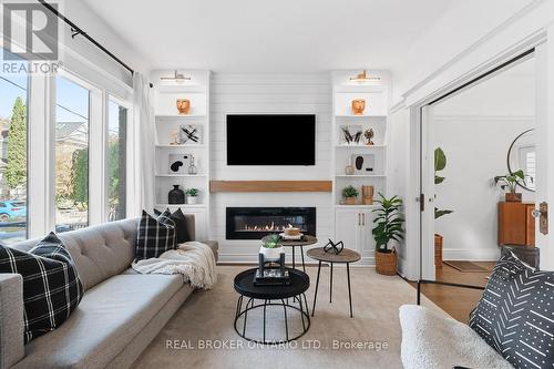7 Juniper Avenue, Toronto, ON - Indoor Photo Showing Living Room With Fireplace