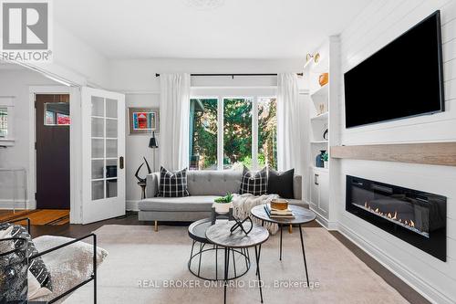 7 Juniper Avenue, Toronto, ON - Indoor Photo Showing Living Room With Fireplace