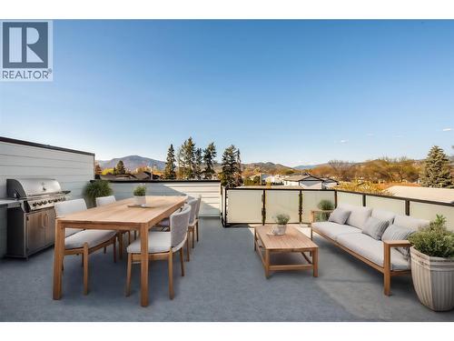 Virtually staged with fun okanagan patio design ideas - 857 Kinnear Court, Kelowna, BC - Outdoor With Deck Patio Veranda