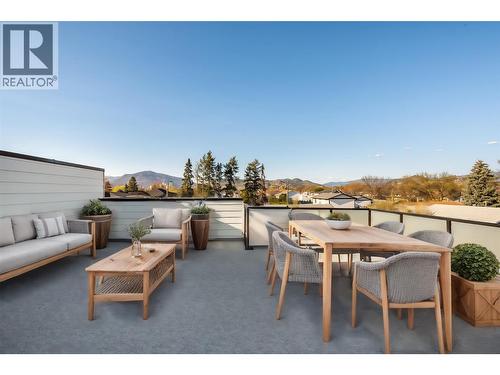 Virtually staged with fun okanagan patio design ideas - 857 Kinnear Court, Kelowna, BC - Outdoor With Deck Patio Veranda