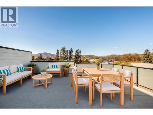 Virtually staged with fun okanagan patio design ideas - 857 Kinnear Court, Kelowna, BC - Outdoor With Deck Patio Veranda