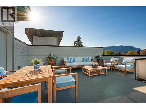 Virtually staged with fun okanagan patio design ideas - 857 Kinnear Court, Kelowna, BC - Outdoor With Deck Patio Veranda With Exterior