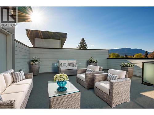 Virtually staged with fun okanagan patio design ideas - 857 Kinnear Court, Kelowna, BC - Outdoor With Deck Patio Veranda With Exterior