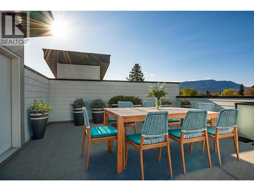 Virtually staged with fun okanagan patio design ideas - 857 Kinnear Court, Kelowna, BC - Outdoor With Deck Patio Veranda With Exterior