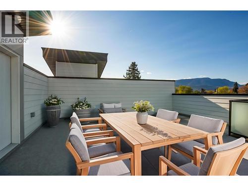 Virtually staged with fun okanagan patio design ideas - 857 Kinnear Court, Kelowna, BC - Outdoor With Deck Patio Veranda With Exterior