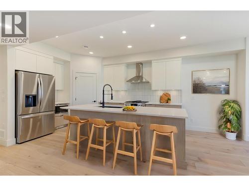 Virtually staged with fun design ideas - 857 Kinnear Court, Kelowna, BC - Indoor Photo Showing Kitchen With Stainless Steel Kitchen With Upgraded Kitchen