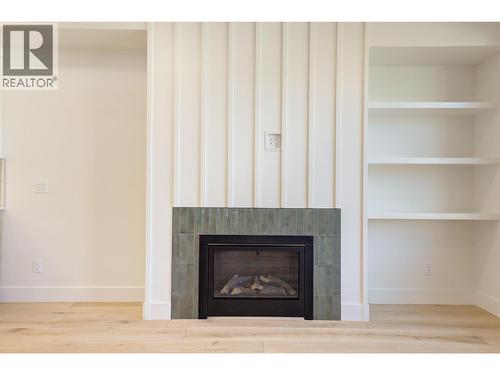 Natural gas fireplace - 857 Kinnear Court, Kelowna, BC - Indoor With Fireplace