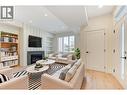 Virtually staged with fun design ideas - 857 Kinnear Court, Kelowna, BC  - Indoor Photo Showing Living Room With Fireplace 