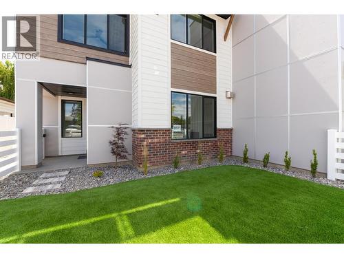 fenced front and back yard - 857 Kinnear Court, Kelowna, BC - Outdoor With Exterior