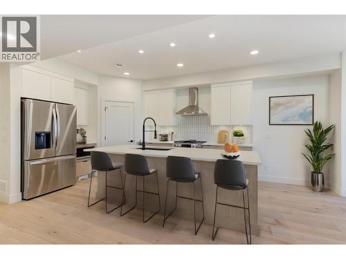 Virtually staged with fun design ideas - 857 Kinnear Court, Kelowna, BC - Indoor Photo Showing Kitchen With Stainless Steel Kitchen With Upgraded Kitchen