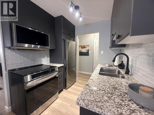 112 17Th  S Avenue Unit# 101, Cranbrook, BC - Indoor Photo Showing Kitchen With Stainless Steel Kitchen With Double Sink
