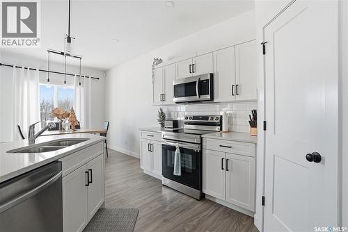 153 Echo Lane, Martensville, SK - Indoor Photo Showing Kitchen With Stainless Steel Kitchen With Double Sink