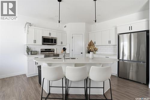 153 Echo Lane, Martensville, SK - Indoor Photo Showing Kitchen With Stainless Steel Kitchen With Upgraded Kitchen