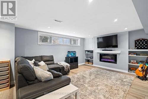 21 Decarie Circle, Toronto, ON - Indoor Photo Showing Living Room With Fireplace